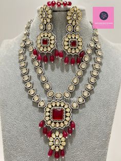 Elevate your style with this exquisite Ruby Premium Dual Tone uncut Polki Kundan Necklace. Inspired by the glamorous designs of Sabyasachi and Indian Bollywood celebrities, this fine Kundan Necklace exudes luxury and sophistication. Perfect for making a statement at any Pakistani or Punjabi event, this necklace is sure to turn heads and make you feel like a true celebrity. Add a touch of traditional elegance to your ensemble with this stunning piece. Bollywood Designer Heavy Sets, Bollywood Heavy Designer Wear Sets, Bollywood Style Necklaces For Eid, Traditional Festive Kundan Necklace, Festive Bollywood Heavy Traditional Wear, Heavy Bollywood Traditional Wear For Festive Season, Bollywood Style Heavy Traditional Wear For Festive Season, Festival Designer Kundan Necklace With Stone Work, Festival Kundan Necklace With Stone Work For Designer Wear