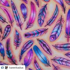 an image of colorful feathers painted on paper