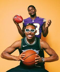 a man holding a basketball while sitting on top of another man's shoulders, both wearing sunglasses