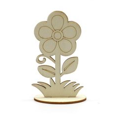 a wooden cutout of a flower on a white background