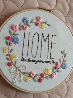 a hand embroidered hoop with the words home is where your mom is