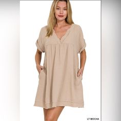 New Boutique Item Zenana Light Mocha Rolled Short Sleeve Raw Edge V-Neck Dress This Light Mocha V-Neck Dress Is The Epitome Of Comfort And Style. Its Short Sleeves And Raw Edge Detailing Add A Cute And Trendy Touch To Its Neutral Color, Making It The Perfect Choice For Any Spring Event. Stay Comfortable And Stylish All Day Long With This Must-Have Dress. Fabric Content: 100% Cotton Brown V-neck Midi Dress, Cream V-neck Dress For Day Out, Chic Brown V-neck Dress For Spring, Beige V-neck Dress For Summer Brunch, Beige V-neck Dress For Summer Beach, Casual V-neck Dress For Brunch, Neutral V-neck Spring Dress, Beige Summer V-neck Dress For Beach, Brown V-neck Mini Dress For Spring