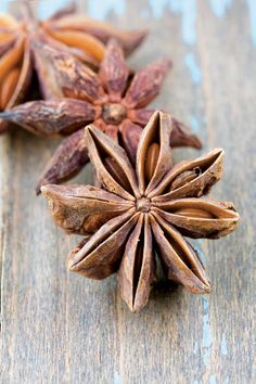 star anise on a wooden table with other ingredients