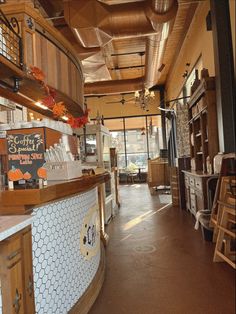 the inside of a restaurant with lots of counter space and wooden shelves on each side