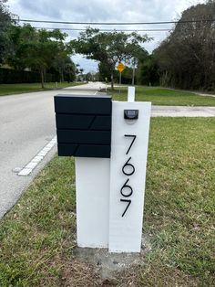 a mailbox sitting on the side of a road