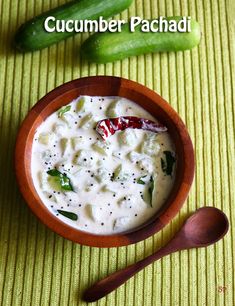 cucumber pachaddi in a wooden bowl with spoon