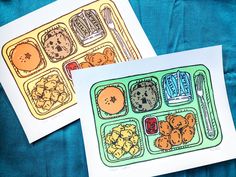 two cards with food illustrations on them sitting next to each other in front of a blue background