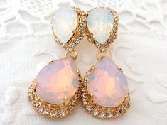 "Pink and white opal Chandelier earrings, Bridal earrings, Bridesmaids gift, Dangle earrings, Drop earrings, Weddings jewelry, Swarovski earrings, Powdered pink, Blush pink, Beauty with Statement. These stunning earrings have a great statement look that can't be missed. They would be great bridal earrings or with an evening dress. Wonderful bridesmaids' gift They are made of 14k gold plated brass posts, Swarovski crystals, all set in prong setting. Made with CRYSTALLIZED™ - high qulity genuine S Elegant White Pink Opal Jewelry, Gold Pink Opal Jewelry For Wedding, Wedding Gold Jewelry With Pink Opal, Opal Drop Earrings For Wedding, Silver Opal Earrings For Wedding, Opal Jewelry With Matching Earrings For Wedding, Opal Chandelier, Earrings Weddings, Bridesmaid Earring