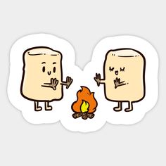 two toasted breads sitting next to a campfire