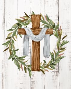 a painting of a cross with leaves around it on a white wooden background that is painted in watercolor