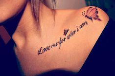 a woman with a tattoo on her shoulder that says love me for not amn