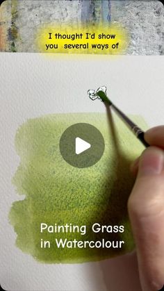 someone is painting grass in watercolour