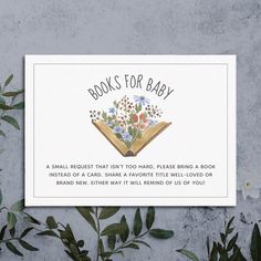 an open book with flowers and leaves on it next to the words books for baby