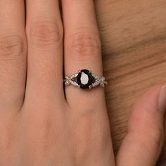 It is natural black spinel ring. The main stone is 7 mm*9 mm oval cut.weight about 2.16 carats. The basic metal is sterling silver and plated with rhodium. To change the metal to a solid gold (white/rose) or platinum is also available, please ask for a quotation if you want. You can also go to my shop Home for more elegant rings: https://www.etsy.com/shop/godjewelry?ref=hdr_shop_menu More black spinel rings: https://www.etsy.com/shop/godjewelry?section_id=21680005 Customization is always welcome Black Spinel Ring, June Birthstone Ring, Spinel Ring, Sterling Silver Wedding Rings, Alexandrite Ring, Dream Engagement, Etsy Wedding Rings, Black Spinel, Dream Engagement Rings