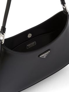 Prada Cleo Shoulder Bag - Farfetch Luxury Rectangular Shoulder Bag With Logo Plaque, Luxury Shoulder Bag With Top Handle And Logo Plaque, Luxury Shoulder Bag With Logo Plaque And Top Handle, Luxury Shoulder Bag With Logo Plaque For Business, Black Leather Bags With Logo Plaque, Classic Travel Baguette Bag With Branded Hardware, Luxury Satchel Shoulder Bag With Silver-tone Hardware, Luxury Shoulder Bag With Silver-tone Hardware, Luxury Crossbody Baguette Bag For Business