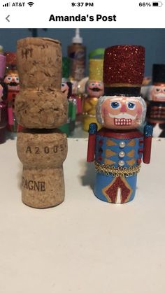 two wooden nutcrackers sitting next to each other on top of a table