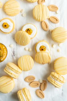 an assortment of macaroni and cheese pastries on a white surface with peanut butter