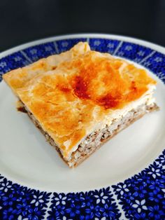 a piece of pie on a blue and white plate