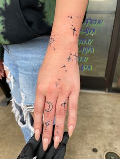 Tattoo, hand tattoo, crescent moon Stardust Hand Tattoo, Sun Moon Star Hand Tattoo, Astronomy Hand Tattoo, Starry Hand Tattoo, Hand Tattoos Moon And Stars, Hand Sparkles Tattoo, Celestial Hand Tattoos For Women, Sun Moon Hand Tattoo