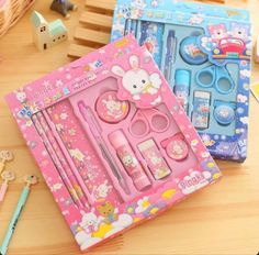 hello kitty stationery set with scissors, pencils and pens on a table next to other items