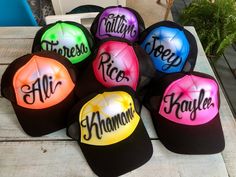 six hats with the names of different countries on them sitting on top of a table