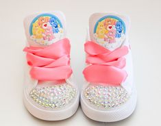 How adorable are these Care Bear inspired converse! The perfect shoe to complete the look! Please leave your name needed in the notebox during checkout Visit the tutu section or search bar for the matching outfit! These are our Basic Bling Converse, if you want more bling or other details please visit our bling shoe section to purchase a different design If you are unsure of sizing please scroll to the last photos for our size charts, or visit our size charts here--> https://pinktoesnhairbows.com/pages/size-chart All sales are FINAL, Ship dates can be found directly on the listing, please view our policies in detail here---> https://pinktoesnhairbows.com/pages/policies-terms-conditions Cute Low-top Sneakers For Birthday, Cute High-top Sneakers As Gift, Customizable Cute Lace-up Sneakers, Cute Customizable Lace-up Sneakers, Customizable Lace-up Cute Sneakers, Alice In Wonderland Shoes, Bear Shoes, Overalls Boys, Tutu Dress Costumes