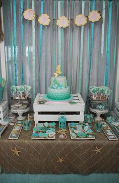 a table topped with a cake and desserts