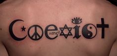 a man's chest with the word coexist written in black ink on it