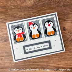 a card with three penguins on it