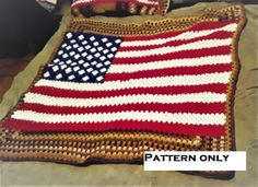 an american flag crocheted afghan on a bed with the words pattern only written across it