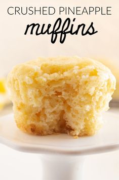 a close up of a muffin on a plate with the words crushed pineapple muffins