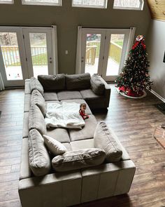 a large sectional couch in the middle of a living room