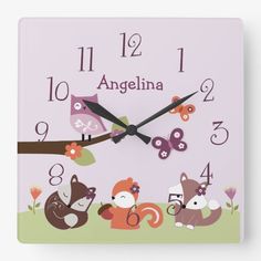 a square clock with animals on it and the words angelina written in large numbers