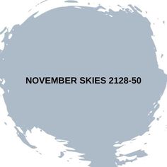 the words november skies are painted in black on a white background with gray and grey paint