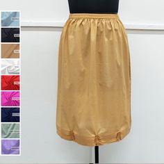 Discover the timeless allure of the cotton half slip with pintex work at bottom. Crafted from high-quality cotton, it offers comfort and elegance. Perfect for a seamless silhouette, it adds a layer of modesty to skirts and dresses. Embrace classic style with this versatile wardrobe essential. Cotton Underskirt / Cotton Petticoat / Cotton Half Slip / Cotton Dress Liner ➡️Sale for 1 Half Slip with pintex work at bottom. ➡️100 % Light Weight Cotton.. ➡️Care: Hand wash in cold water. Do not bleach.  ➡️Available sizes : (Measurements are of garment only) X-SMALL- Fits US Size 0-2 (Elastic waistband 21.5" inch relax to 24.5" inch stretched, Hip 35" inch). SMALL- Fits US Size 2-4 (Elastic waistband 23" inch relax to 27" inch stretched, Hip 38" inch). MEDIUM- Fits US Size 6-8 (Elastic waistband 27 Solid Stretch Skirt For Daywear, Half Slip, Slip Skirt, Petticoat, Cotton Dresses, Wardrobe Essentials, Dress Skirt, Classic Style, Slip On