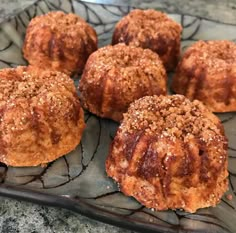 several pastries are on a glass plate