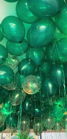 green balloons are floating in the air