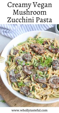 pasta with mushrooms and broccoli in a white bowl on top of a wooden cutting board