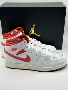 Elevate your sneaker game with these limited edition Air Jordan 1 Mid SE in White/ Lobster-Dune Red-Sail. These classic high top shoes are perfect for any occasion, whether you’re looking for activewear, casual, or workwear. The lace-up closure ensures a secure fit while the leather outsole provides durability and style. This shoe features a color-block pattern and silhouette that pays homage to Michael Jordan himself. It comes in a size 7 US shoe size, 6 UK shoe size, and 40 EU shoe size. These sneakers are perfect for any season, be it winter, summer, fall, or spring. With such a versatile shoe, you can use it for a wide range of performance activities such as volleyball, cross-training, basketball, football, and much more. Training Basketball, Air Jordan 1 Mid Se, Jordan 23, Sneaker Games, Block Pattern, Air Jordan 1 Low, Air Jordan 1 Mid, Jordan 1 Mid, High Top Shoes