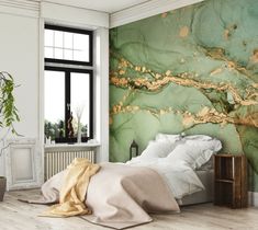 a bedroom with green marble wallpaper and white bedding