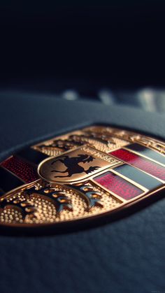 a close up view of the emblem on a car's leather seat cushion,