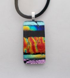 "Awesome  necklace of dichroic glass . The size is 1 1/4\" by 5/8\" and it has 18\"  black satin chain. All my jewelry come in a nice gift box." Dichroic Jewelry, Dichroic Glass Jewelry, Dichroic Glass Earrings, Dichroic Pendant, Fused Glass Ornaments, Satin Noir, Dichroic Glass Pendant, Kailua Kona, Dichroic Glass