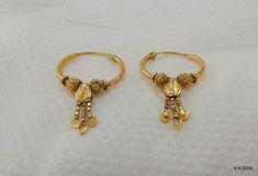 Vintage old 18kt gold earring pair from rajasthan india. great handmade design good for jewelry collection. weight - 2.490 grams size - 2.8/1.6 cm material - 18kt yellow gold. Antique 22k Yellow Gold Earrings, Pierced Byzantine Style Ceremonial Earrings, Ceremonial Yellow Gold Earrings, Antique 22k Gold Chandbali Jewelry, Antique Hallmarked Earrings For Festive Occasion, Antique Gold Earrings With Latkans, Traditional Brass Hoop Earrings For Festivals, Traditional Festive Brass Hoop Earrings, Handmade Festive Temple Hoop Earrings