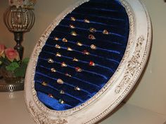 an ornately decorated toilet seat with blue velvet