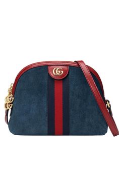 Crafted in blue suede with inlaid blue and red Web stripe, this Ophidia shoulder bag has a vintage-inspired domed shape, presented in a chromatic combination that plays with emblematic colors of the House.Blue suede with blue and red Web. Red leather trim. Shiny gold-toned hardware. Microfiber lining. Double G. Zipper pullers with Double G charms. Interior open pocket and smartphone pockets. Adjustable shoulder strap with 44cm drop. Zipper closure. Small size: W 9.25"23.5cm x H 7.5"/19cm x D 3.1 Tas Bahu, Red Web, Gucci Crossbody, Buy Gucci, Navy Leather, Paco Rabanne, Gucci Handbags, Small Shoulder Bag, Blue Suede