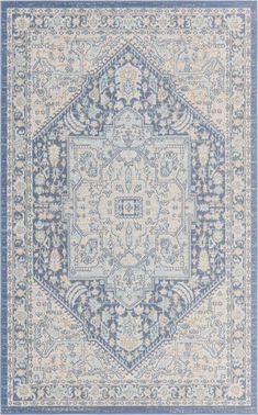 a blue and beige rug with an intricate design