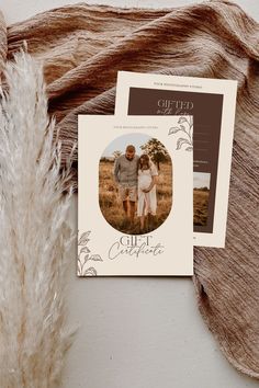 an old photo is displayed on top of a postcard next to a dried plant