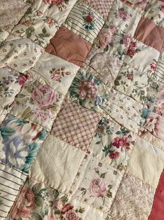 an old quilt is laying on the bed