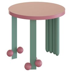 a pink and green table with three balls on it's legs in front of a white background