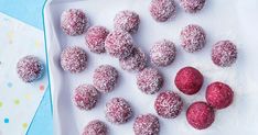 there are some powdered sugar balls and raspberries on the tray